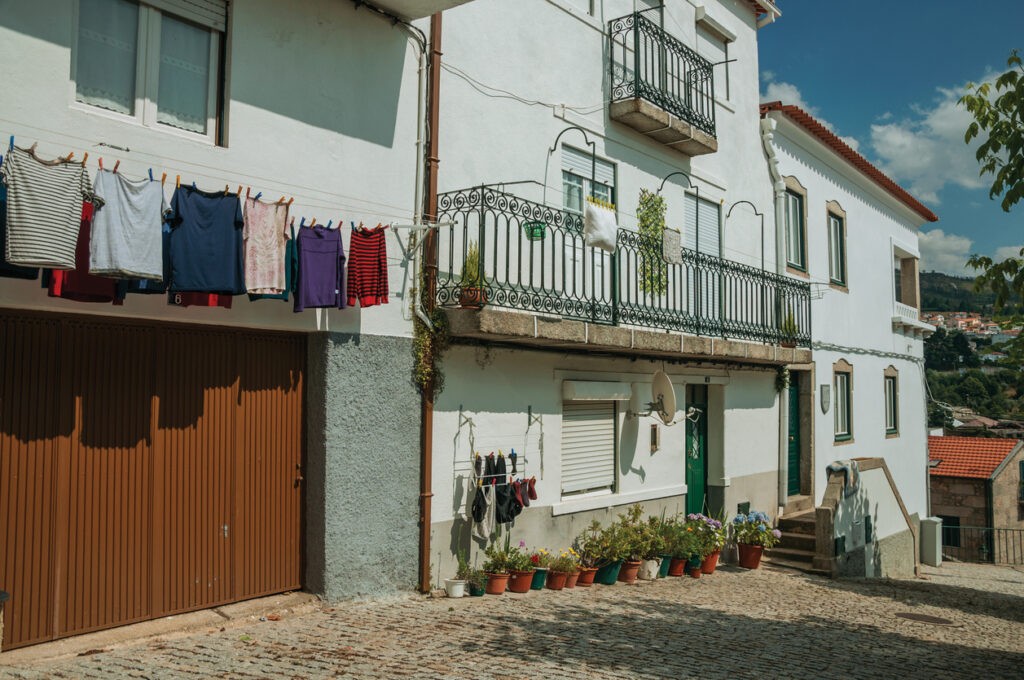 Colorful Clothes Hung To Dry In Front Of Building